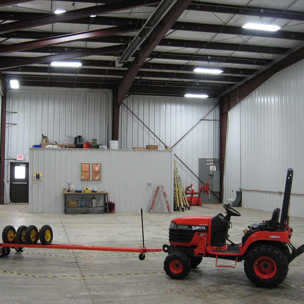 Interior warehouse with a tractor at Kucel Contractors