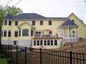 Yellow Kearney home by Kucel Contractors