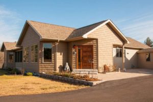 Front of tan modular ranch in Saratoga Springs | Kucel Contractors