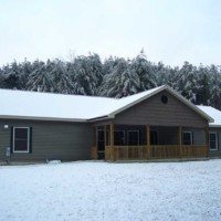 Exterior of home in the snow by Kucel Contractors