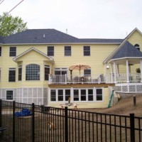 Yellow Kearney home by Kucel Contractors