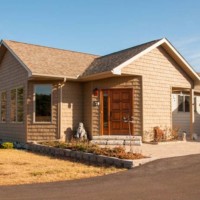 Front of tan modular ranch in Saratoga Springs | Kucel Contractors