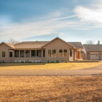 Tan modular ranch in Saratoga Springs by Kucel Contractors